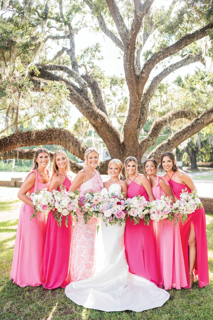 Pretty in Pink:  Heyward&#039;s color palette featured pops of pink in the florals, favors, bridesmaid gowns, and more.