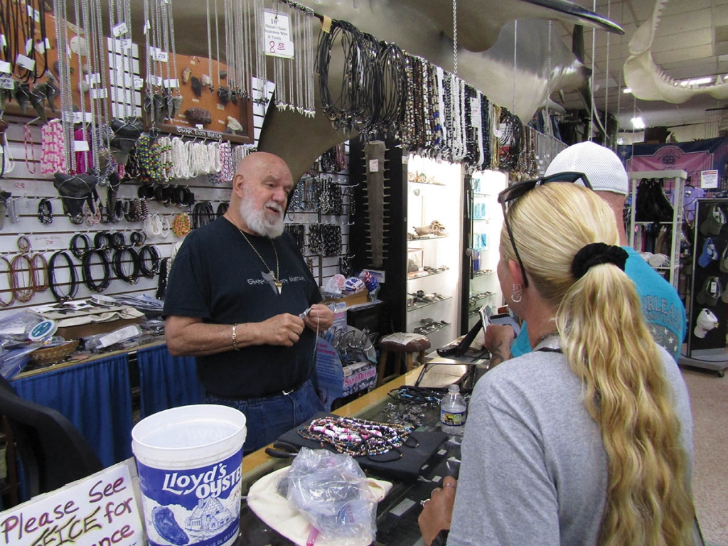 Tom Pierce at work in his business, Trader Bill’s Shark Tooth Cove, inside the Gay Dolphin Gift Cove in Myrtle Beach.