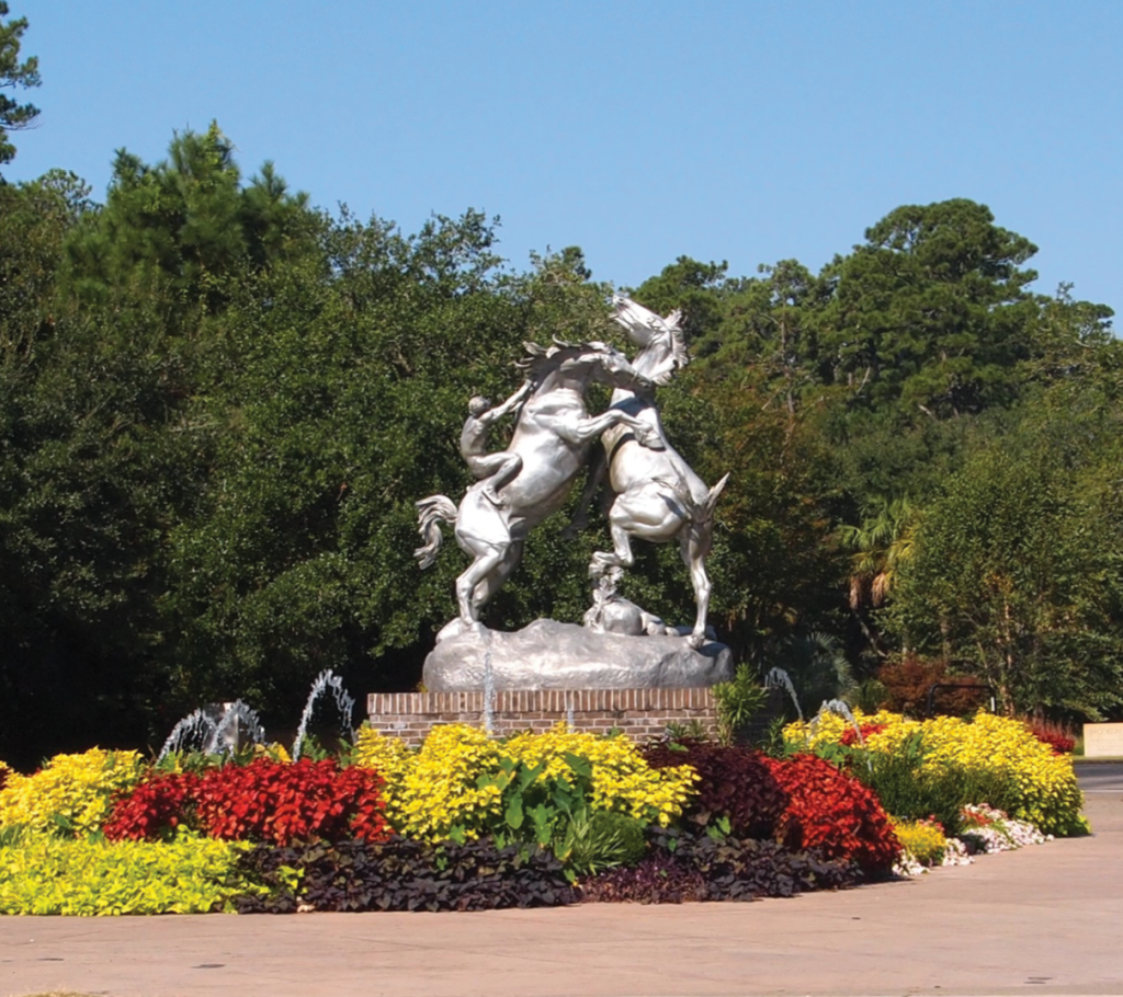 Fighting Stallions, a sculpture by Brookgreen Gardens co-founder, Anna Hyatt Huntington, greets visitors at the main entrance.