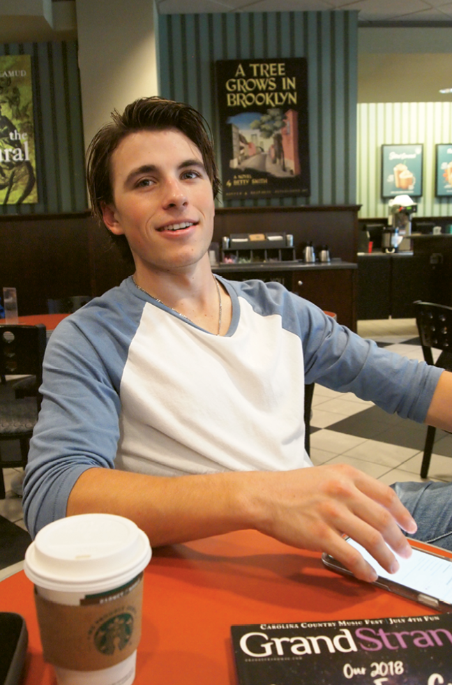 Zak takes a mid-afternoon minute to relax at Starbucks on show days