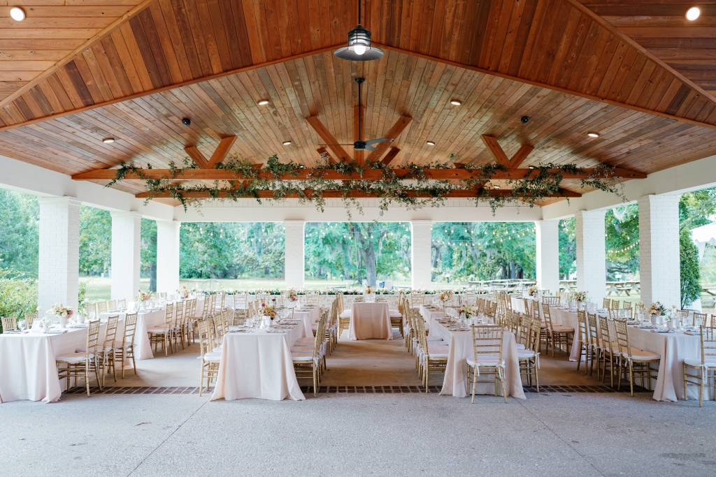 Boho  Chic: Sarah&#039;s theme featured earthy tones, lush greenery, and a bit of bling from mini disco balls mingling with flower arrangements.