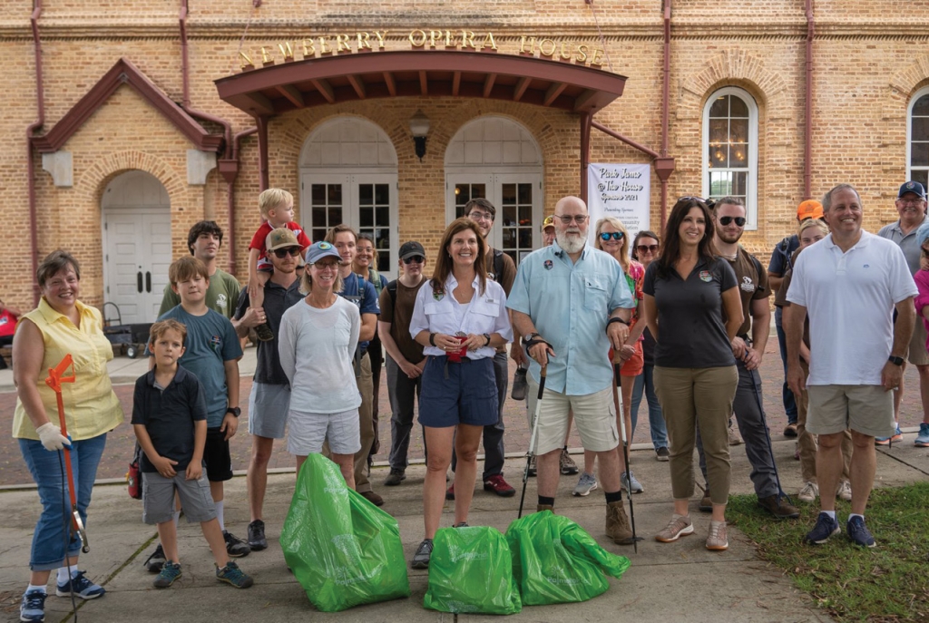 SC Lt. Governor Pamela Evette poses with Dr. Tom Mullikin and members of the SC7 Expedition in front of the Newberry Opera House after nearby clean-up efforts.