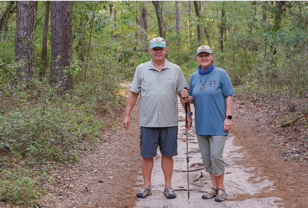 Retired SC National Guard Brigadier General Marie Goff and  her husband, Eddie Goff, pose on one of the trails visited on the SC7 Expedition. The couple volunteer in the statewide environmental awareness effort each year.
