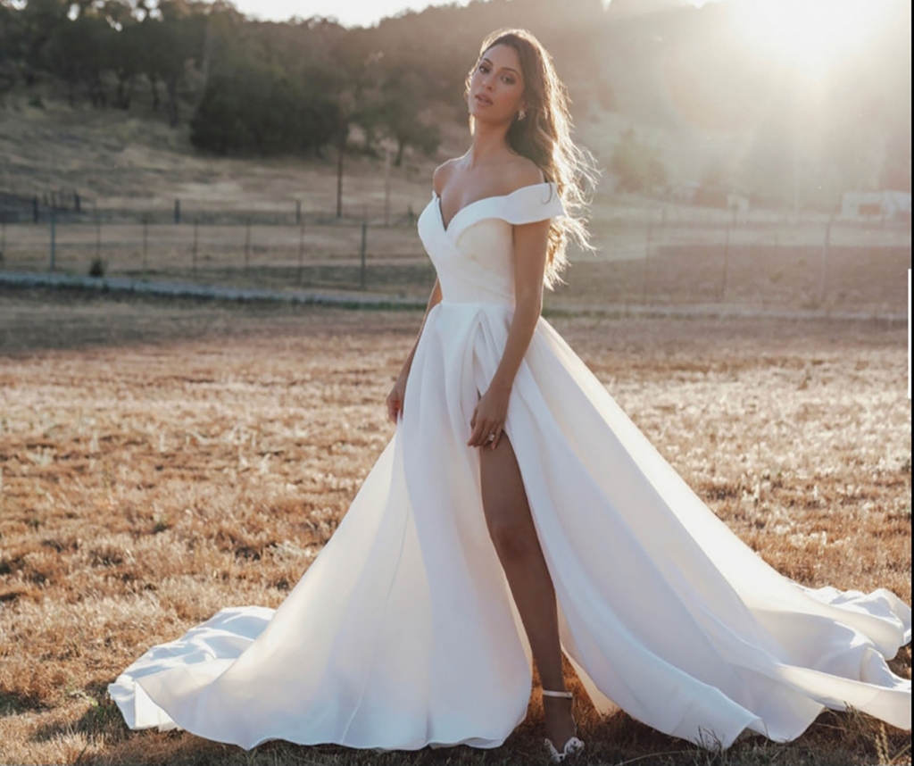 Romance Bridal by Allure - Crisp, architectural organza softly pleats and tucks along the waist and bodice of this romantic off shoulder gown, style 3602.  Irresistible Elegance, $1,469