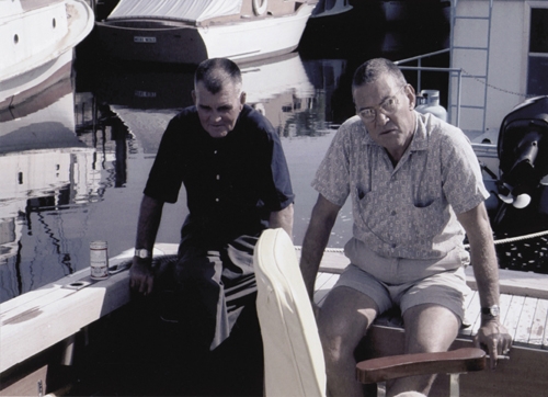 Captain “Biddy” Alderman and Dinks Fitzgerald in the cockpit of the sport fisherman.