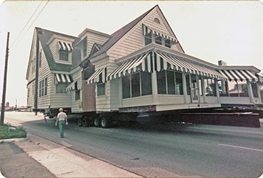 The 150-ton beach home traveled some eight miles in its journey, gathering crowds along the route.