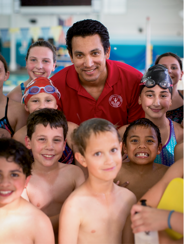 Coach Fabio Silva leads by example for the 100 swimmers on the Coastal Aquatic Club swim team.