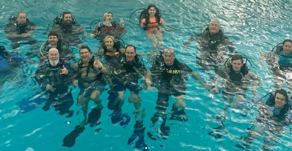 Dr. Tom Mullikin (front, left), a Camden native, poses with SC7 Expedition divers. He has a distinguished military career that prepared him for a life as an adventurer, explorer, and as a tireless advocate for the environment.