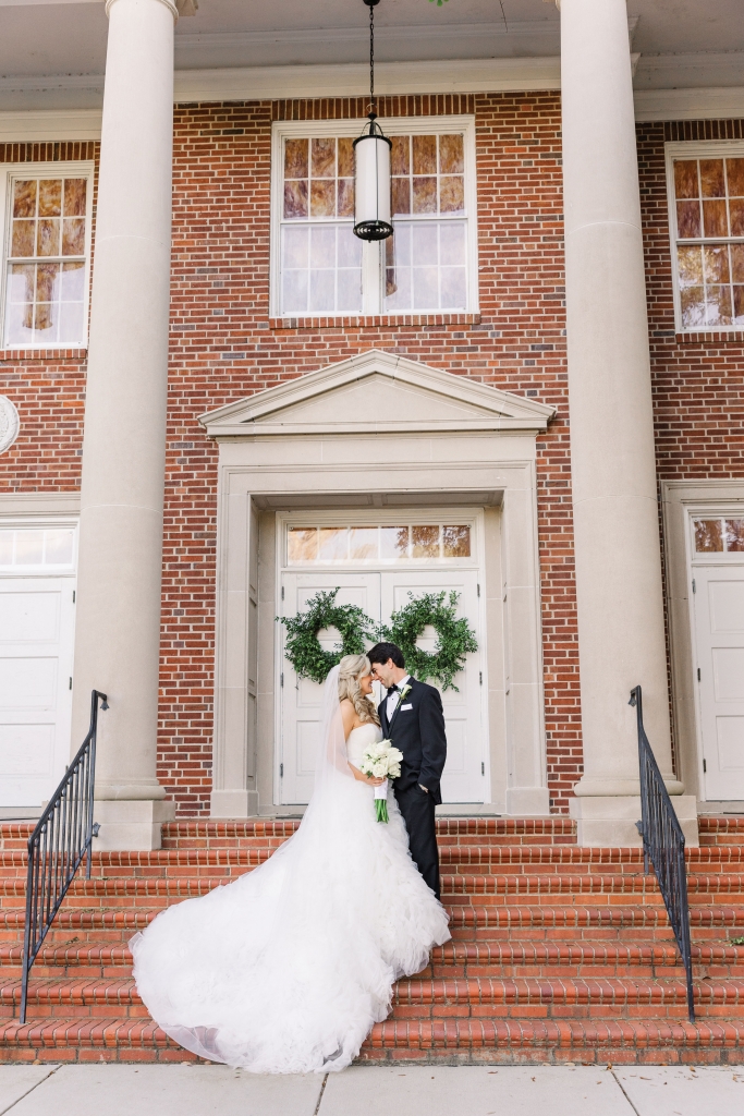 Happy Together: Stephanie and Graham share a private moment on the steps of First Baptist Church in their native home of Conway. Their spring wedding was a traditional Southern black-tie affair, featuring a wedding party comprising 10 bridesmaids and matching number of groomsmen.