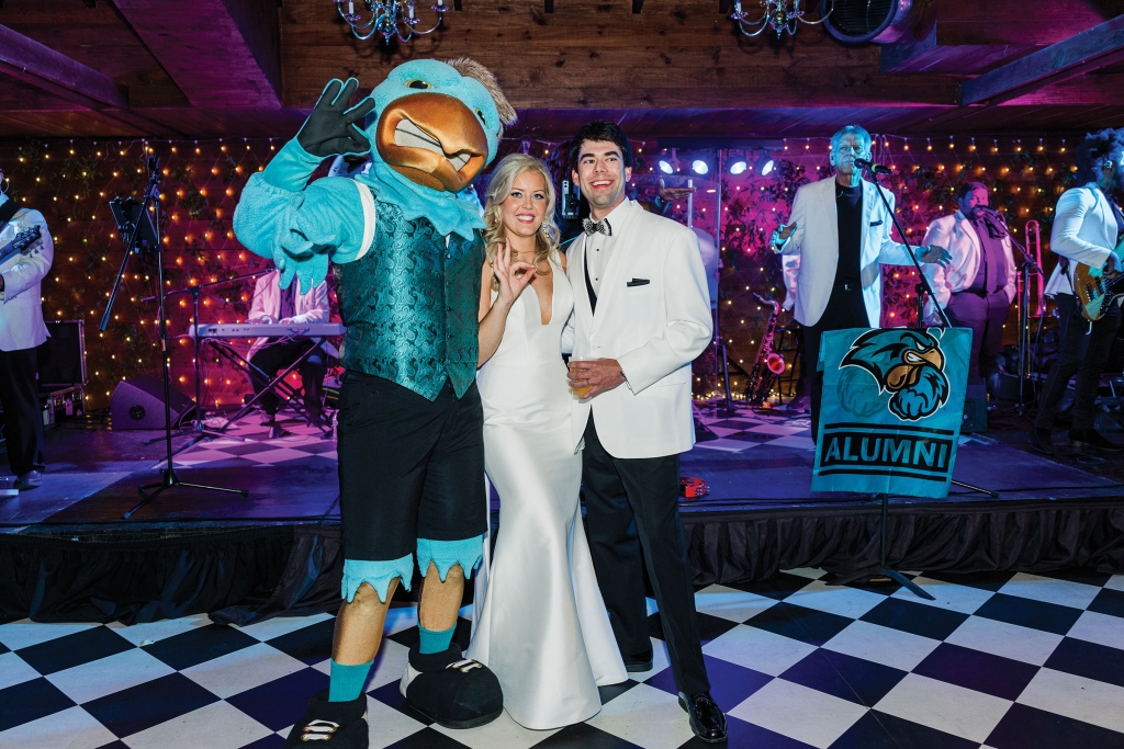 Personal Touches: Beautifully decorated, the historic Peanut Waterhouse hosted the couple&#039;s reception. Treasured family heirlooms were featured throughout the venue. Additionally, guests were treated to a live band and friendly CCU mascot.