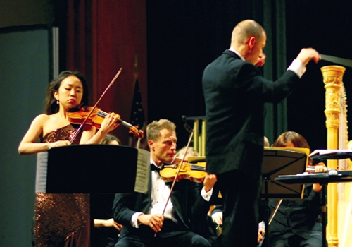 Dr. Charles Jones Evans with guest violinist Jessica Lee in 2010.