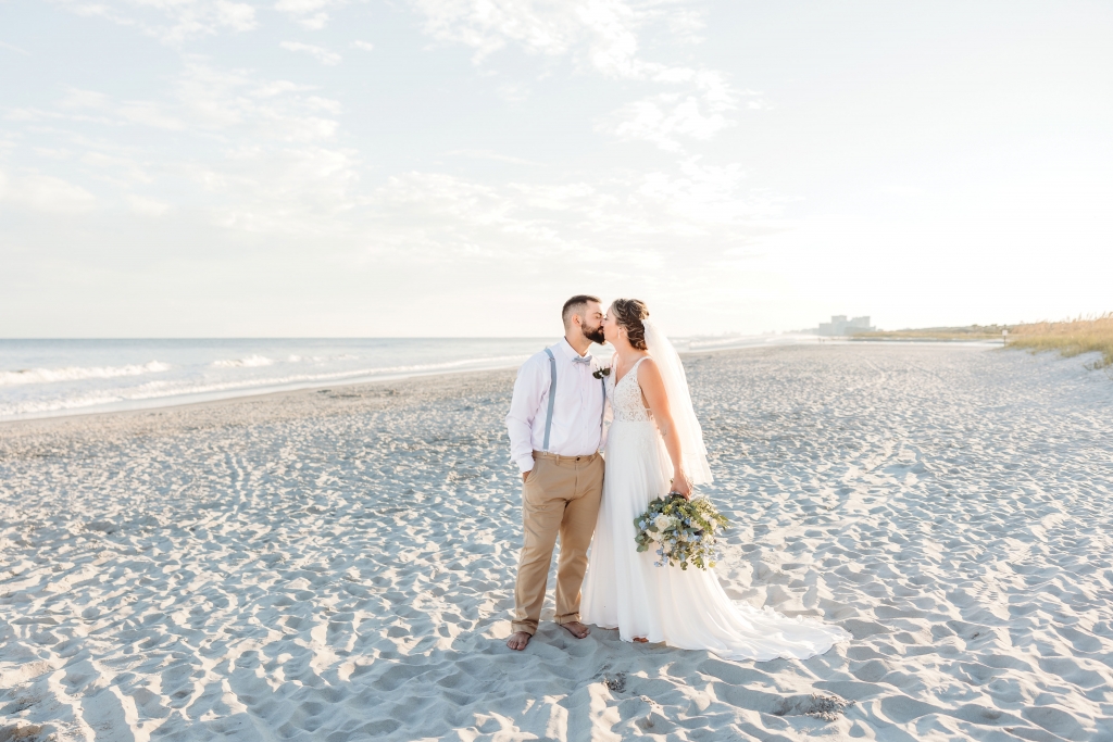 Southern Bell Beach Blues: The Bells chose a beach wedding ceremony with the ocean blue backdrop and a color theme immersed in dusty blue.