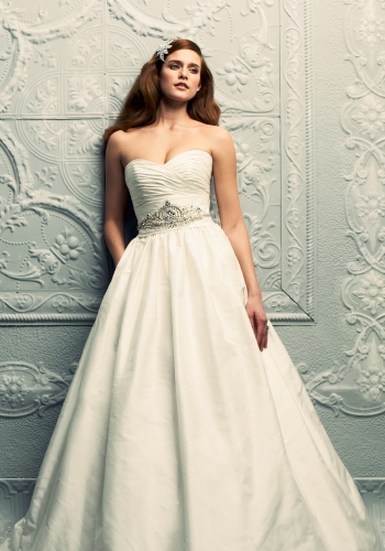 PALOMA BLANCA: A ruched sweetheart neckline and a Swarovski-embellished waist detail make this dupioni silk ballgown sparkle. $1,969. STYLE 4210. THE LITTLE WHITE DRESS, 5001 N. KINGS HWY., (843) 449-4940