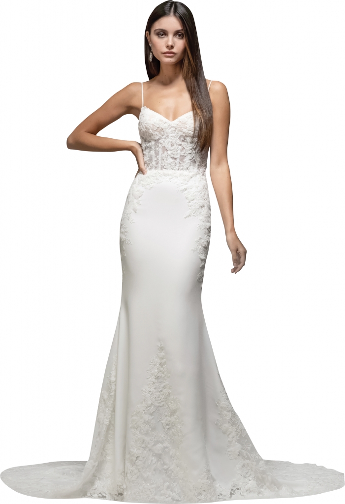Tara Keely Ivory crepe trumpet gown, corseted bodice with lace and three dimensional petals, natural waist, open back with illusion detail, trumpet skirt, and chapel train with lace cutout hem. The Little White Dress, price available upon request.