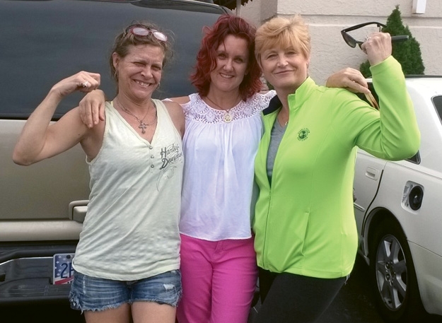 Volunteers Suzanne Brown, Sheri Miller and Cheryl Tuckerman celebrating after Astrid was found