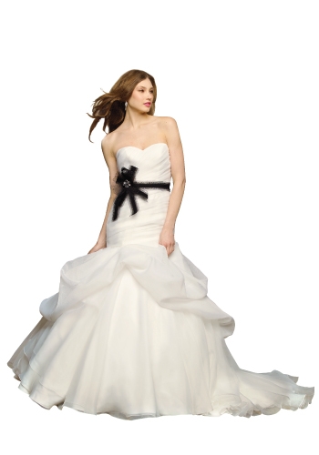 WTOO BY WATTERS AND WATTERS: A fit and flared gown of ivory silk organza with a twist—a diagonally pleated bodice and a skirt with draped pick-ups. $750. “YARDLEIGH.” THE LITTLE WHITE DRESS, 5001 N. KINGS HWY., (843) 449-4940